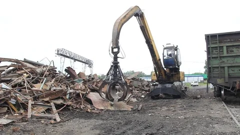 Sorting and loading of scrap metal. Stock Footage 76637003