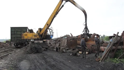 Sorting and loading of scrap metal. Stock Footage 76637008