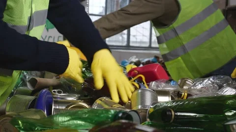 Sorting and Recycling Facility. Manual separation of waste Stock Footage 240057090