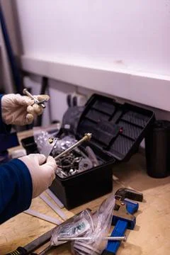 Sorting and Selecting Metal Fasteners and Parts from Toolbox in Workshop 스톡 사진