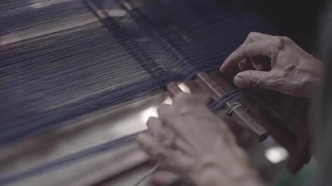Sorting broken threads on traditional looms Stock Footage 248799241