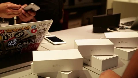 Sorting cellphones on counter Stock Footage 77051922