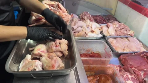 Sorting chicken wings by day in a butcher shop Stock Footage 315393089