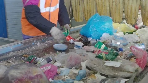 Sorting of garbage on the conveyor of the waste recycling plant, Russia Stock Footage 101948872