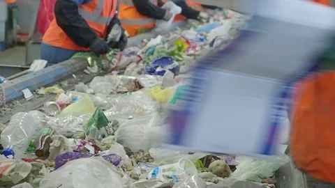 Sorting of garbage on the conveyor of the waste recycling plant, Russia Stock Footage 101948900