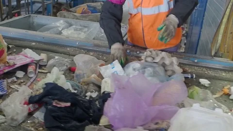 Sorting of garbage on the conveyor of the waste recycling plant, Russia Stock Footage 101948910