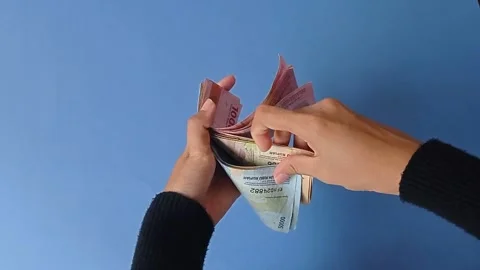 Sorting the  money based on the amount of money Stock Footage 151024685