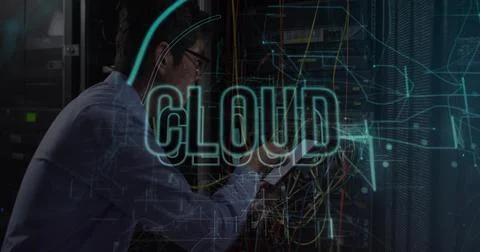 Sorting network cables, tech wearing blue shirt, glasses with tablet in server Foto stock