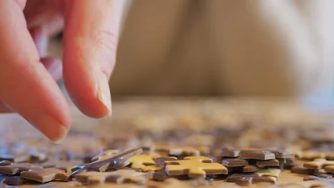 Sorting out puzzle pieces Stock Footage 125711358