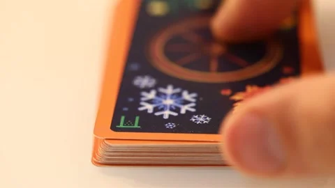 Sorting out tarot cards wheel of the year laid out on a white table, close-u Stock Footage 136574998