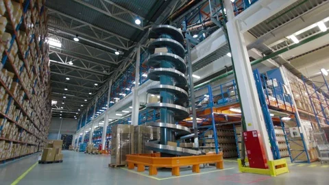 Sorting Parcels at Conveyor inside warehouse Stockbeeldmateriaal 90995749