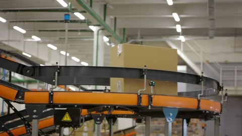 Sorting Parcels at Conveyor inside warehouse Stock Footage 90996274