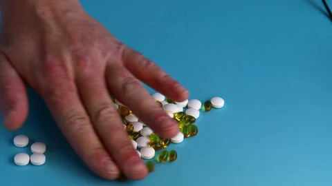 Sorting pills by hand Stock Footage 325151103