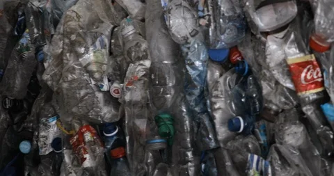 Sorting plastic pet bottles garbage at recycling processing plant, closeup. 動画素材 120123155