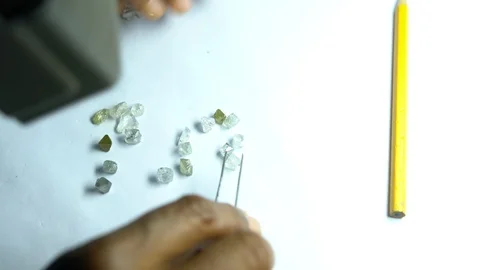 Sorting raw diamonds for valuation Video stock 98076702