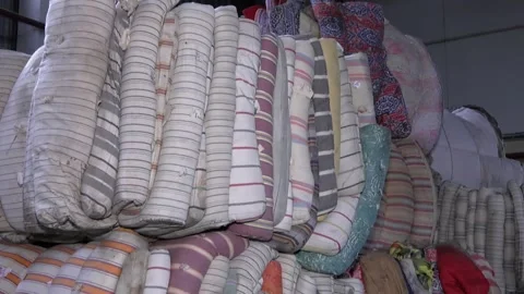 Sorting solid waste. Pressed bale. Recycling textile raw materials Stock Footage 103957040