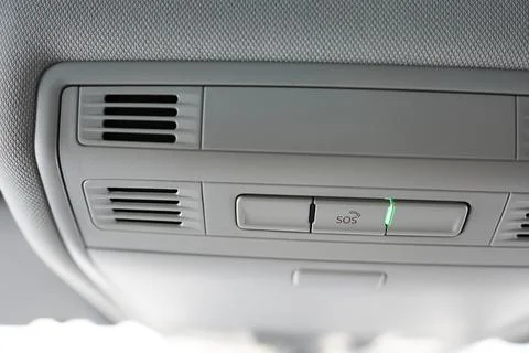 SOS alarm button on the car.  The interior of a modern car. Stock Photos