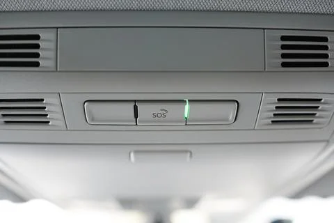 The sos button in a modern car. Button for calling emergency services. Stock Photos
