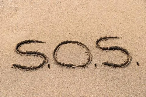 SOS Help Cry For Help On Sand Stock Photos