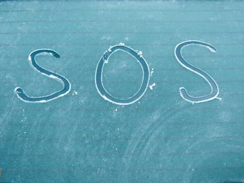 SOS sign for help needed Stock Photos