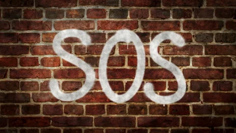 Sos spray painted on the brick wall Video stock 153860039