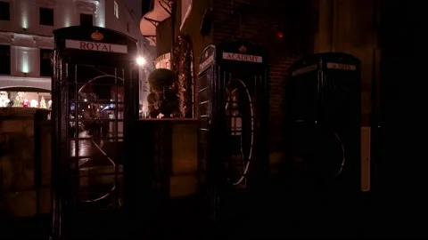 SOS Telephone boxes at night Stock Footage 166874266