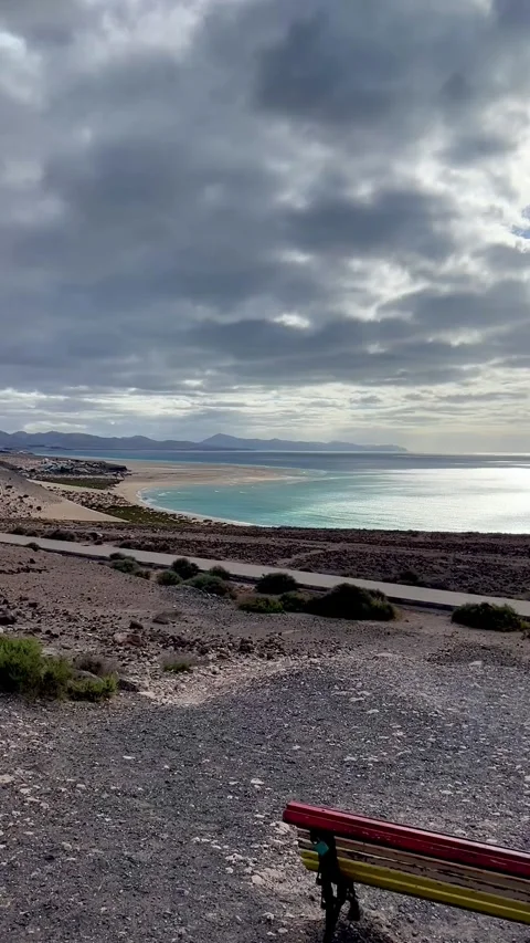 Sotavento beach lagoon bench ocean view cloudy sky Fuerteventura HD vertical Stock Footage 342027794