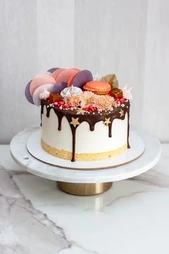Souffle cake with sponge cake, melted chocolate and bright decorations Stock Photos