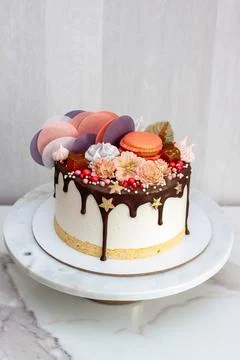Souffle cake with sponge cake, melted chocolate and bright decorations Stock Photos