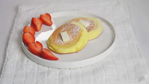 Souffle pancake with fresh strawberry maple syrup fluffy and delicious food Stock Footage 231582753