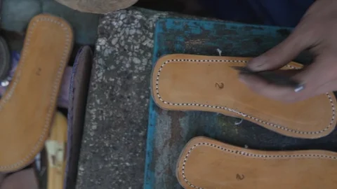 Souk Marrakech Morocco crafting sole shoes typical production hands working Stock Footage 87457448
