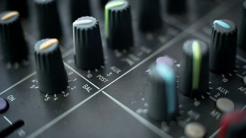 Sound bars flashing on a dj controller, knobs and faders, sound studio equipment Video stock 89777024