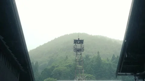 Sound broadcasting tower with green mountain landscape on raining day Stock Footage 272464368