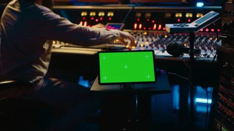 Sound designer processing and recording tracks in control room 스톡 사진