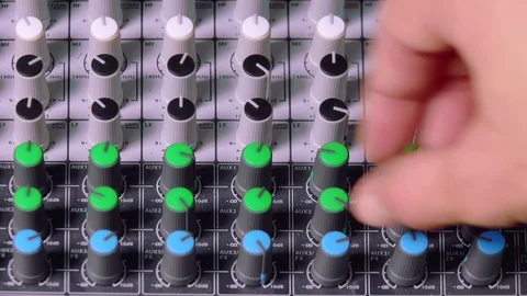Sound engineer adjust levers and knobs for sound check Stock Footage 115498183