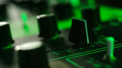 Sound engineer adjusting fader on audio mixing console Stock Footage 337830921