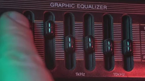 Sound engineer adjusting graphic equalizer knobs Video stock 295195075