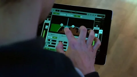 The sound engineer adjusts the sound for the performance of a musical group  Stock Footage 126393438