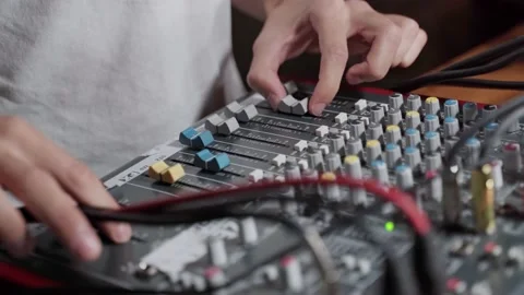 The sound engineer adjusts the sound quality at a party in the club using a Stock Footage 201877065