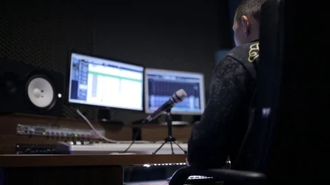 Sound engineer and musicians working in boutique recording studio. Stock Footage 69907505