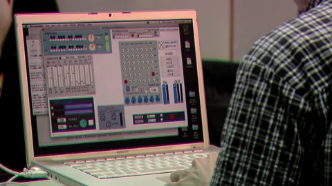 Sound Engineer At Desk with Digital Audio Workstation Software Control Panel. Stock Footage 249006465