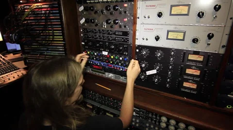 Sound Engineer dialing knobs while drummer plays Video stock 52686726