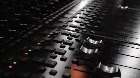 Sound engineer hand adjusting levels on a mixing console Stock Footage 108543932