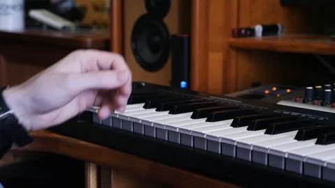 Sound engineer hand turning knobs on mixing board and soundboard while mixing Video stock 111926317