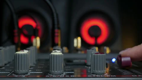 Sound engineer hands adjusting knobs and faders on audio mixer in recording 스톡 동영상 329129897
