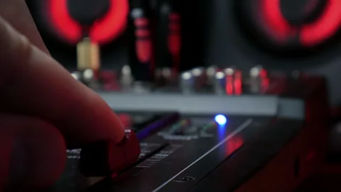 Sound engineer hands adjusting knobs and faders on audio mixer in recording 库存影片 331094742