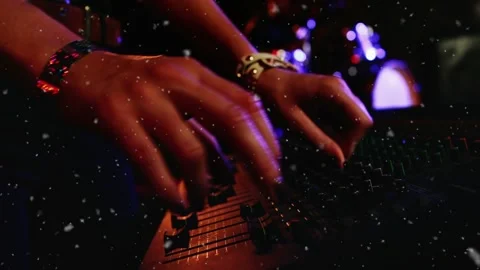 Sound engineer hands finger pressing fader adjusting console with particles over Stock Footage 330355198