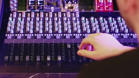 Sound Engineer Operates Audio Mixer In Recording Studio With Neon Lights Stock Footage 330014081