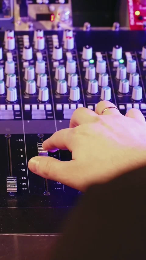 Sound Engineer Operates Audio Mixer In Recording Studio With Neon Lights Stock Footage 330044470