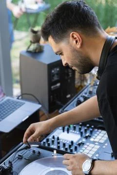 Sound engineer preparing the mixing console before starting the concert Stock Photos